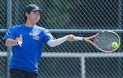 Grayson Kahng of Metuchen hits a return in first singles during the NJSIAA Central, Group 1 boys tennis sectional final between Edison Magnet and Metuchen at Middlesex County College in Edison, NJ on 6/4/24.
