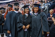 From left to right: Kevin Anthony Jones, Ebony Campbell and Monique Jones attending William Paterson University's undergraduate commencement at the Prudential Center in Newark, New Jersey, May 20, 2025.