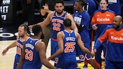 New York Knicks guard Jalen Brunson (11), center Mitchell Robinson (23), center Karl-Anthony Towns (32), forward Mikal Bridges (25) and teammates celebrate after Game 3 of the Eastern Conference finals of the NBA basketball playoffs against the Indiana Pacers Sunday, May 25, 2025, in Indianapolis.