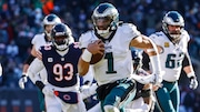 Philadelphia Eagles quarterback Jalen Hurts runs for a touchdown during an NFL game against the Chicago Bears on Dec. 18, 2022, at Soldiers Field in Chicago.