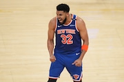 New York Knicks center Karl-Anthony Towns (32) reacts after scoring against the Indiana Pacers during the second half of Game 3 of the Eastern Conference finals of the NBA basketball playoffs Sunday, May 25, 2025, in Indianapolis.