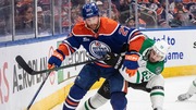 Dallas Stars' Evgenii Dadonov (63) and Edmonton Oilers' Brett Kulak (27) battle for the puck during the third period of Game 3 of the NHL hockey Stanley Cup Western Conference finals in Edmonton, Alberta, Sunday, May 25, 2025. (Jason Franson/The Canadian Press via AP)