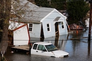 A house on Cliffwood Way in Laurence Harbor can be seen coming apart from the flood waters from Hurricane Sandy. Wednesday, October 31, 2012. New Jersey officials said buyouts typically take place after natural disasters like Sandy. However, the NJDEP is trying to develop a more proactive system.