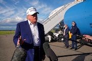 President Donald Trump speaks to reporters before boarding Air Force One at Morristown Municipal Airport in Morristown, N.J. on Sunday.