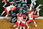 Philadelphia Eagles quarterback Jalen Hurts (1) is pushed over the goal line by teammates to a touchdown against the Kansas City Chiefs during the first half of the NFL Super Bowl 59 football game, Sunday, Feb. 9, 2025, in New Orleans. (AP Photo/Godofredo A. Vásquez, File)